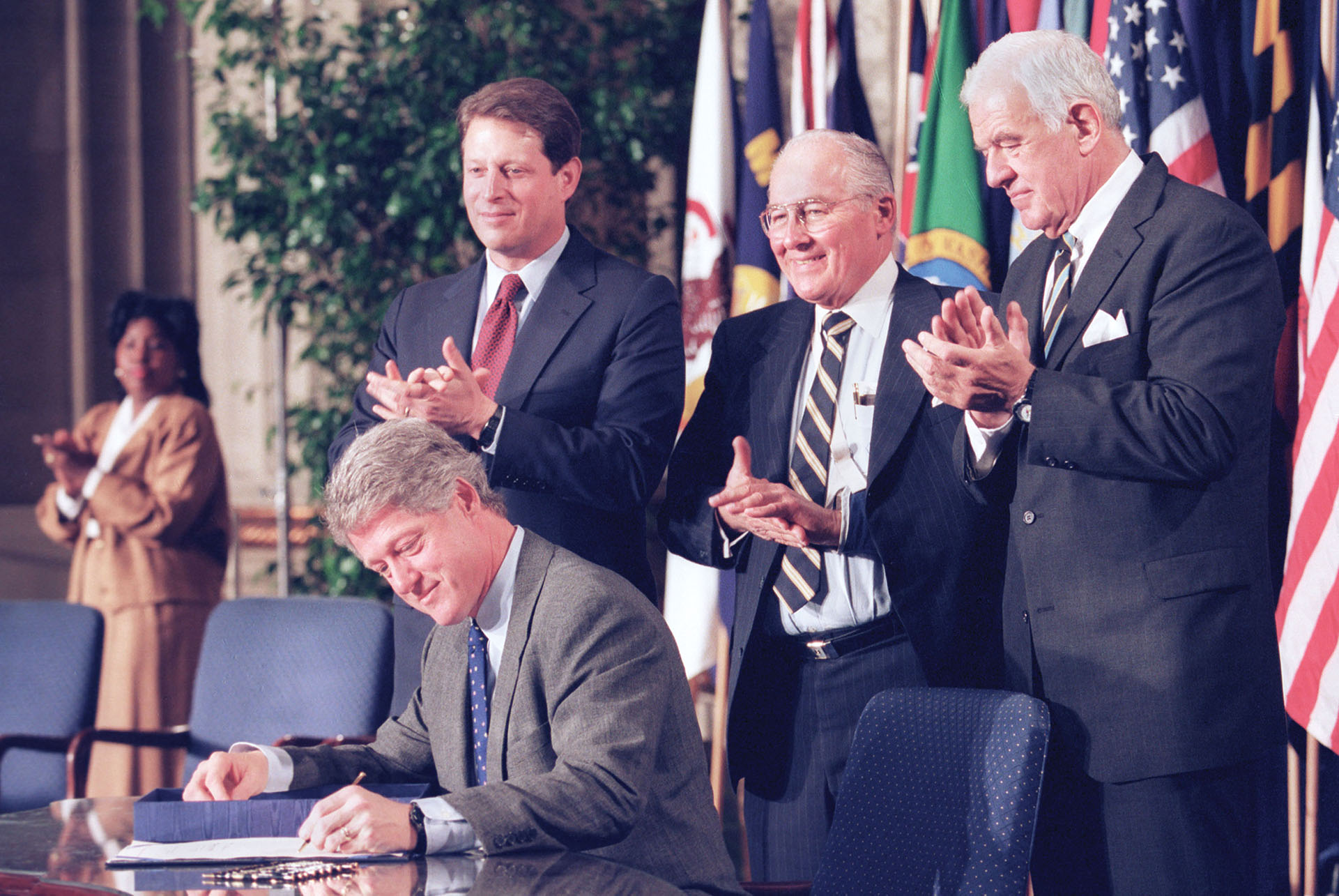 Bill Clinton signing NAFTA into law, 1993